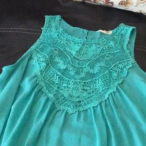 Lacy sleeveless top with keyhole back